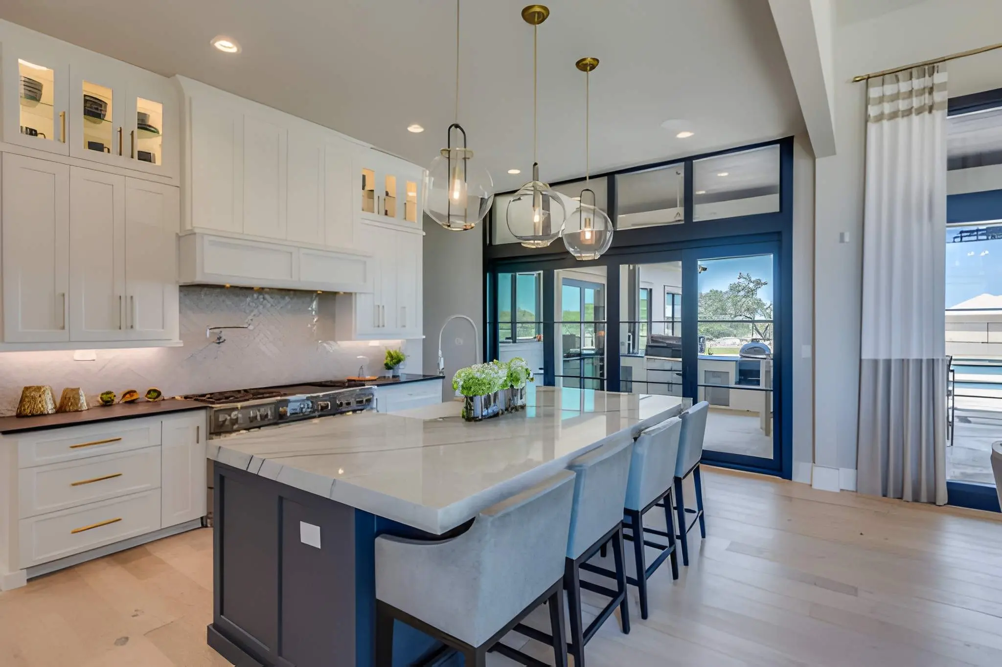 General Contractor in Del Valle completing a modern kitchen renovation with custom cabinets and lighting